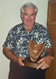 George with baseball glove carving