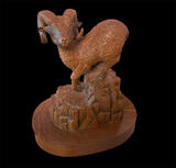 big horn sheep on mountain carving